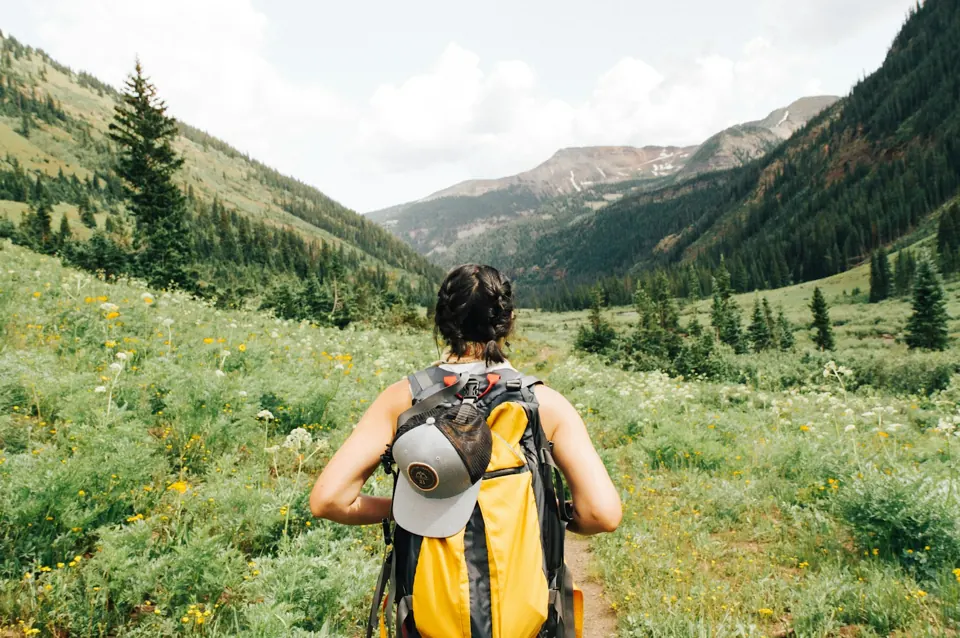 Person carrying yellow and black backpack