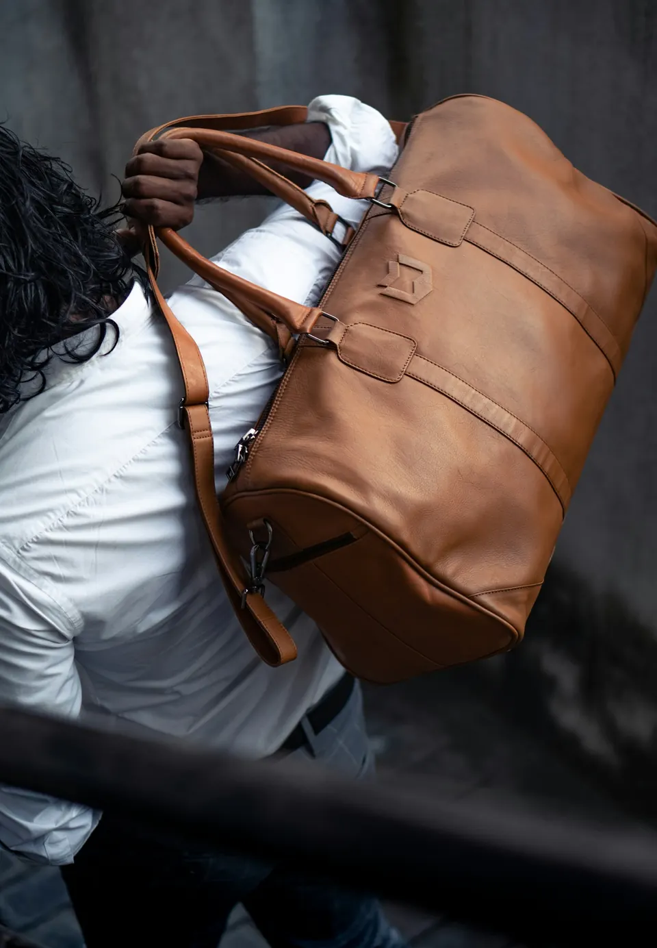 A man carrying a large brown bag