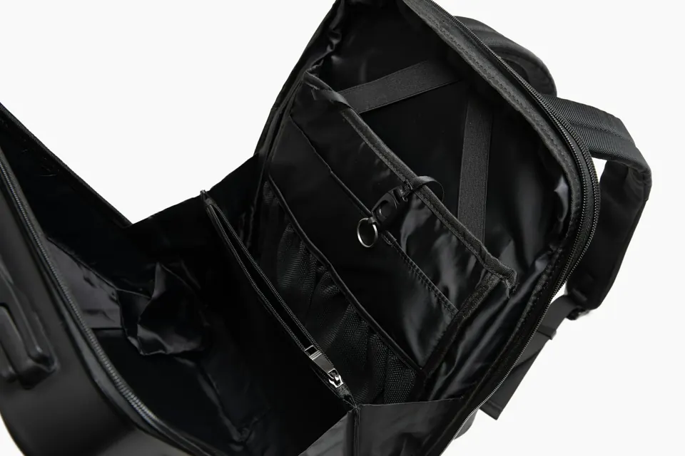 A black backpack with a strap
