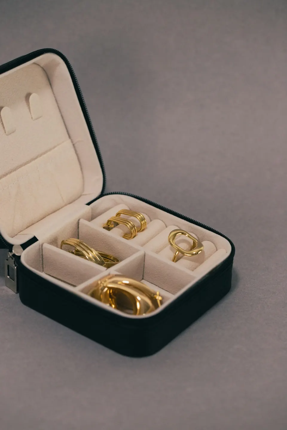 A black jewellery case with rings