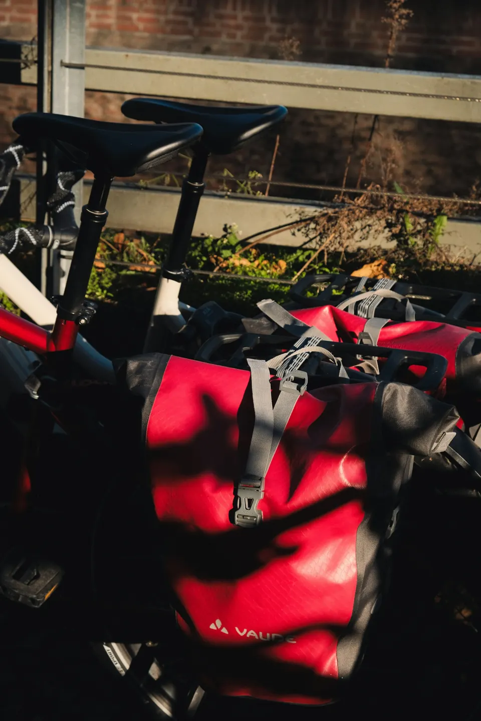 Two bicycles with red panniers