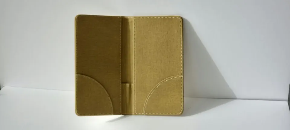An open tan folder standing on a white background