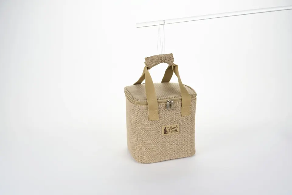Beige woven cooler bag with fabric handles