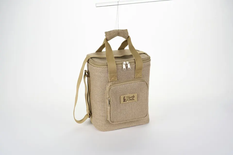 Beige woven cooler bag with a shoulder strap